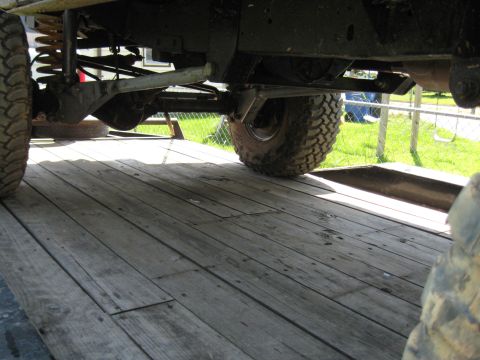 1978 Ford Bronco - Close-up of the undercarriage and suspension system of a 4x4 vehicle.