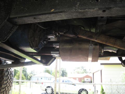 1978 Ford Bronco - A view of the underside of a vehicle, focusing on the exhaust and drive shaft.