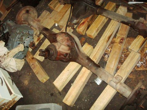 1995 Ford Bronco - Two vehicle rear axle assemblies are shown resting on wooden blocks.