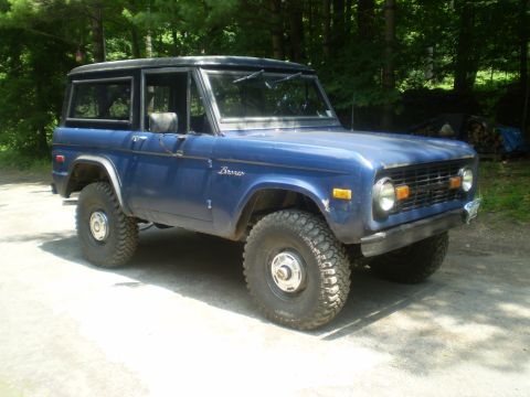 1979 Ford Bronco - This blue Ford Bronco is shown from the front 3/4 angle, parked outdoors.