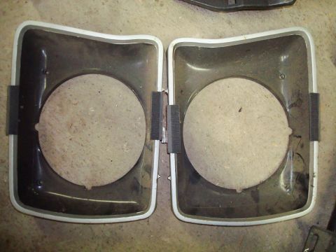 1995 Ford Bronco - Pair of headlight bezels shown from the front, ready for installation or repair.