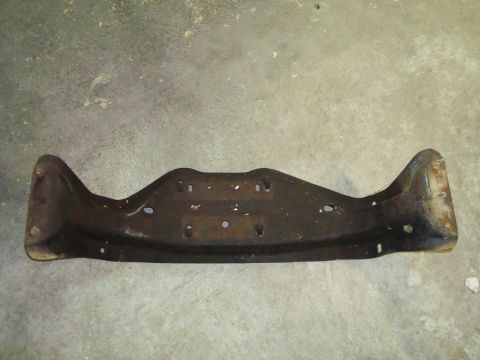 1995 Ford Bronco - A metal bracket, likely a vehicle part, is shown against a concrete background.