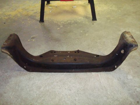 1995 Ford Bronco - This is a metal bumper bracket, likely from a vehicle, shown on a concrete floor.