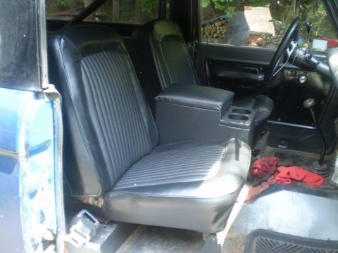 1979 Ford Bronco - Interior view of a blue vehicle, showing the front seats and dashboard details.