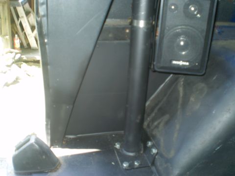 1979 Ford Bronco - A speaker is mounted to the interior panel of the vehicle, near a roll bar.