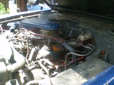 1979 Ford Bronco - Close-up view of a vehicle's engine bay, showing various components and wiring.