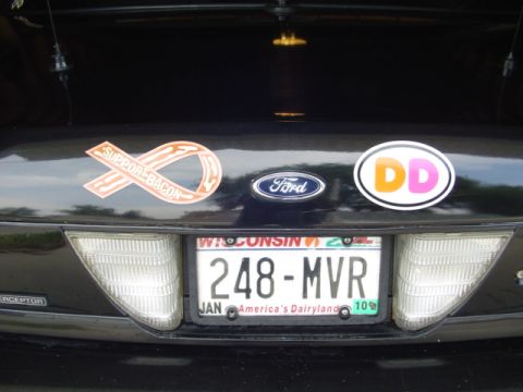 2000 Ford Crown Victoria - Rear view of a 2000 Ford Crown Victoria, displaying various stickers and its license plate.