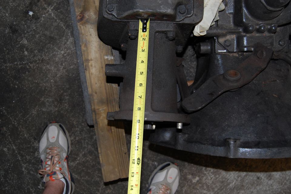 Transmission part being measured with a yellow tape measure