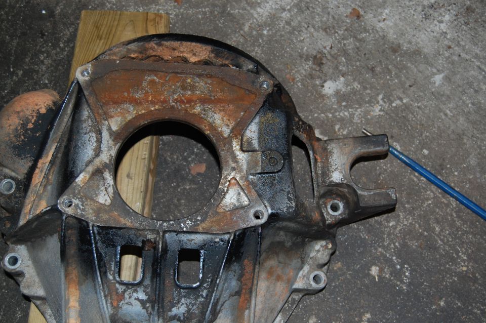 Rusted metal part with blue cable