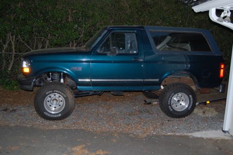 1994 Ford Bronco - This 1994 Ford Bronco is shown in a side profile, a teal paint job and lifted suspension.