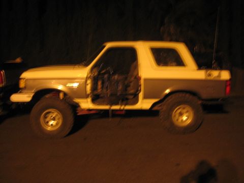 1989 Ford Bronco - This lifted Ford Bronco has its doors removed, revealing the interior cage structure.