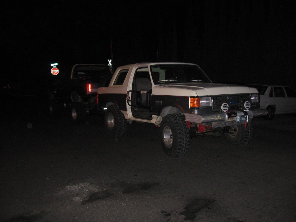 Two-tone lifted Ford Bronco with off-road modifications and winch
