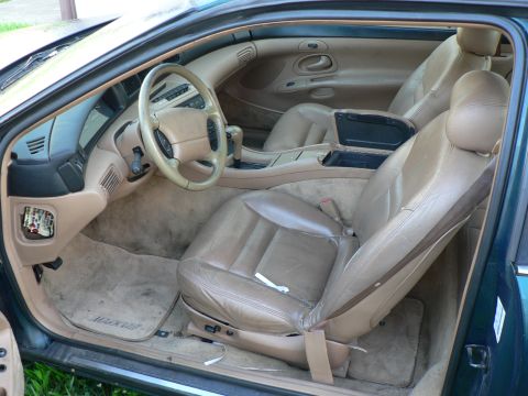 1990 Lincoln Mark VII - Console lid latch broken, missing fuse cover, wear hole in driver's seat