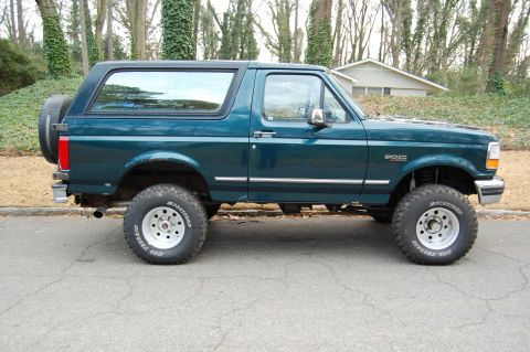 1994 Ford Bronco - This 1994 Ford Bronco is shown from the side, parked outdoors.