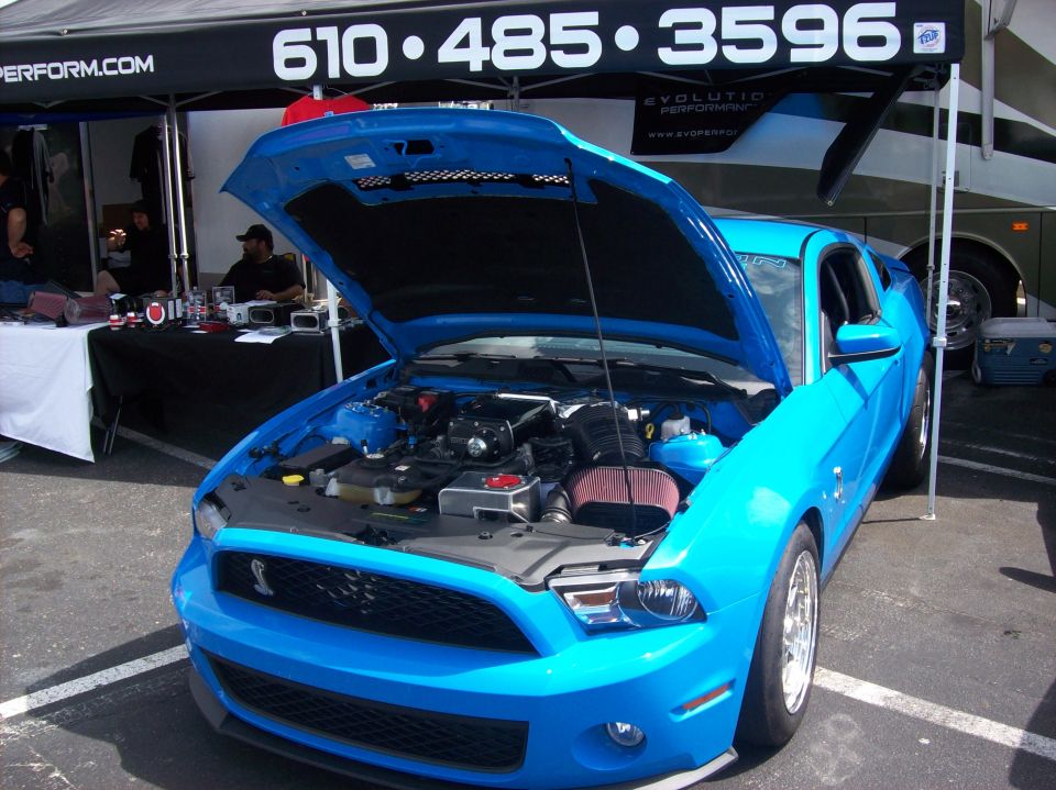 Blue 2007 Ford Mustang with hood open, showing engine and front grille