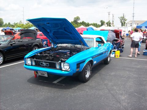 2007 Ford Mustang - A bright blue 1971 Ford Mustang convertible is displayed with its hood open, revealing the engine bay.