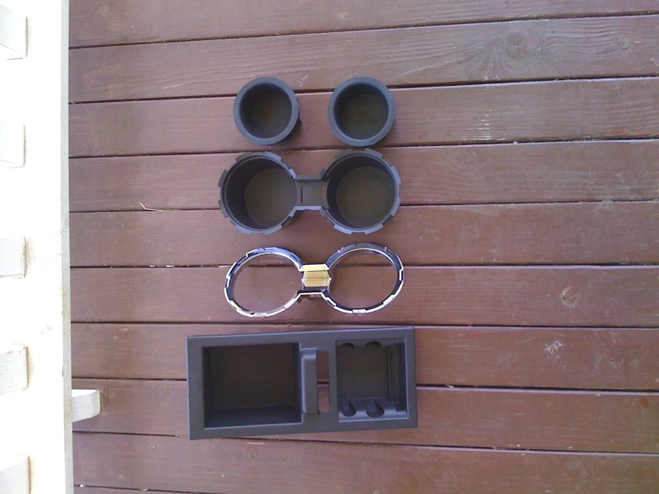 Cupholder inserts, cupholder, trim ring and inside-console storage organizer. No clips or tabs have been broken everything is intact and not scratched.