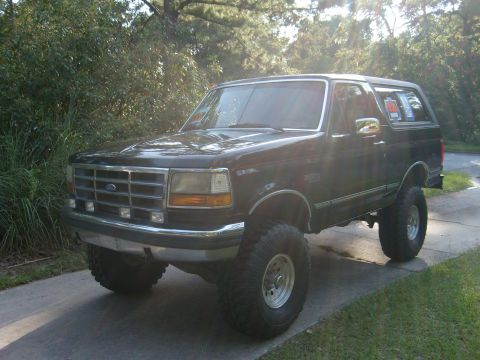 1992 Ford Bronco - This lifted 1992 Ford Bronco is presented in a three-quarter front view, its stance and aftermarket modifications.
