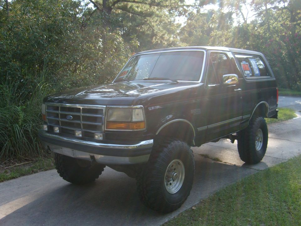 Black lifted 1992 Ford Bronco with aftermarket wheels and tires