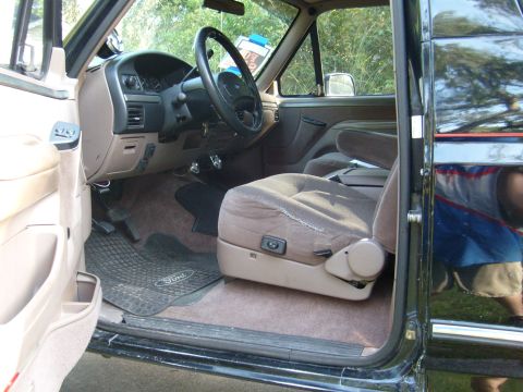 1992 Ford Bronco - Interior view of a 1992 Ford Bronco, highlighting the driver's side seat and dashboard.