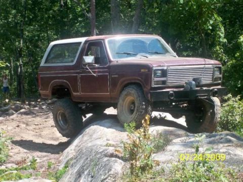 1980 Ford Bronco - 1980 Ford Bronco navigating a challenging rocky trail.