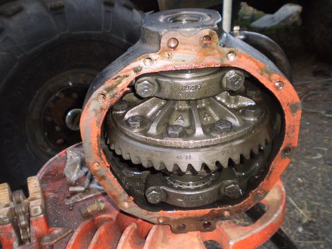 1978 Ford Bronco - Close-up view of a vehicle's differential housing, revealing internal gears and stamped part numbers.