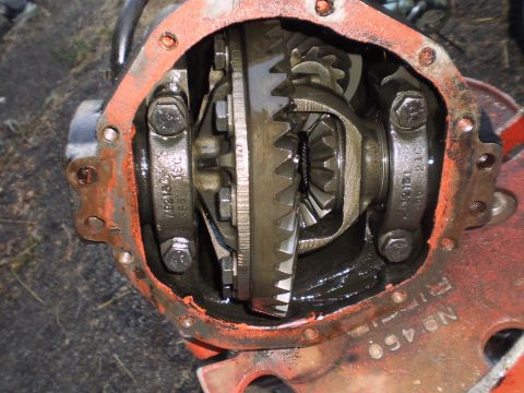 1978 Ford Bronco - The internal workings of a vehicle's differential are exposed, showing the gears and housing.
