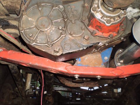 1978 Ford Bronco - Underside view of a vehicle's transfer case and exhaust system, showing mechanical components.