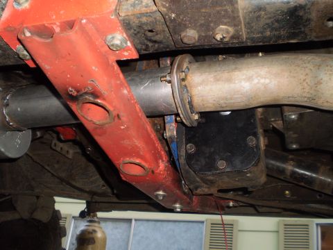 1978 Ford Bronco - Close-up of vehicle's undercarriage showing exhaust system and frame modifications.