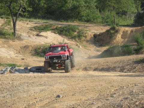 1979 Ford Bronco - A red off-road truck navigates a dusty trail at Mountainside Off-Road Park in July 2009.