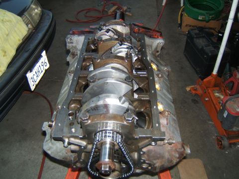1988 Ford Bronco - Engine block assembly with crankshaft and timing chain visible, likely undergoing a rebuild or modification.