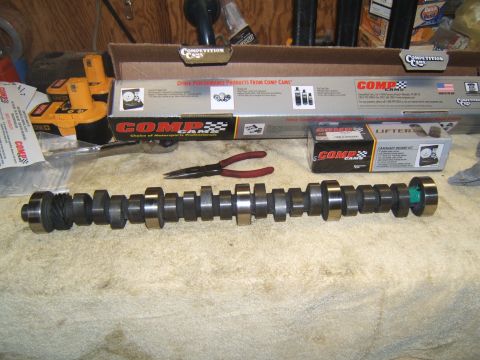 1988 Ford Bronco - Engine parts laid out on a cloth, including a camshaft, lifter kit, and Comp Cams boxes.