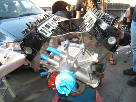1988 Ford Bronco - V8 engine block and intake manifold assembly, with blue tape on ports.