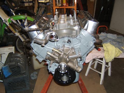 1988 Ford Bronco - A V8 engine, likely a Ford 351W, is shown on an engine stand, ready for assembly or modification.