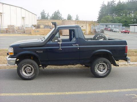 1993 Ford Bronco - This 1993 Ford Bronco features a snorkel and a spare tire mounted in the bed.