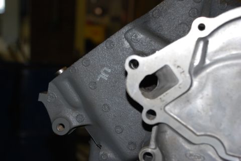 1996 Ford Bronco - Engine block part with visible markings, likely from a Ford vehicle.