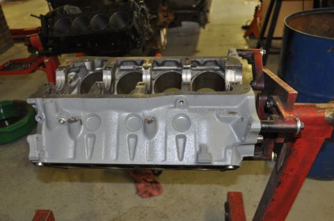 1996 Ford Bronco - Engine block on a stand in a workshop setting.