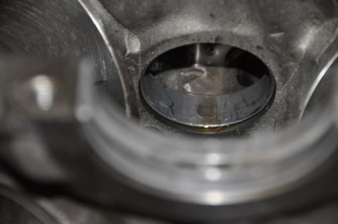 1996 Ford Bronco - Engine cylinder bore showing wear and oil, likely from a tear-down process.