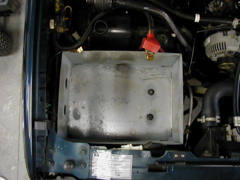 1995 Ford Bronco - dual battery box utilizes the same space as the stock. Only mod was to the air intake that had to be cut shorter.