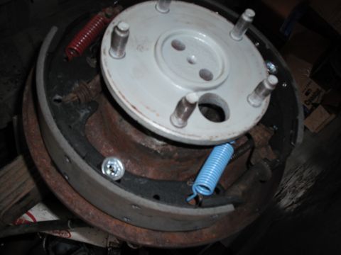 1991 Ford Bronco - Close-up view of a drum brake assembly, rusty components and new springs.