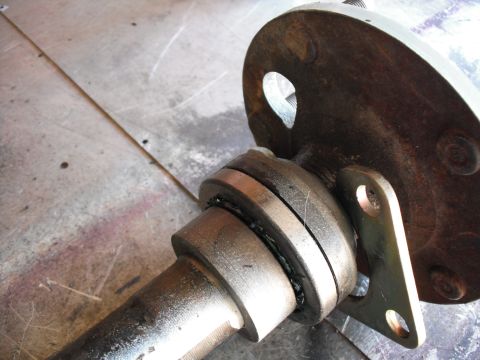 1991 Ford Bronco - A close-up view of a mechanical axle assembly, likely a component from a vehicle's drivetrain.