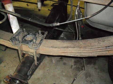 1991 Ford Bronco - Close-up view of the rear axle and leaf spring assembly, showing the U-bolt mounting hardware.