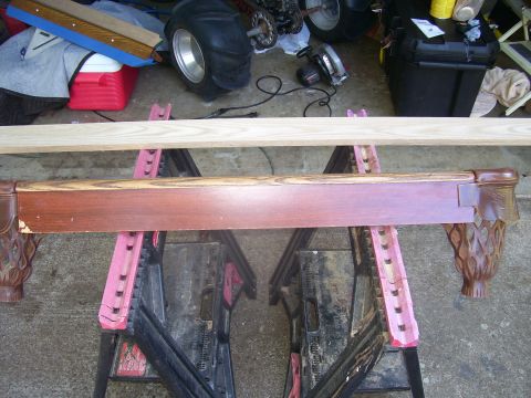 1991 Ford Bronco - A pool table rail is supported by sawhorses, with various tools and a tire visible in the background.