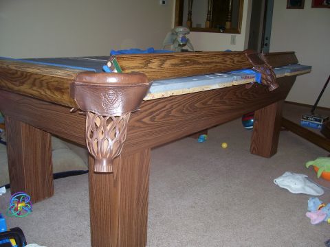 1991 Ford Bronco - A pool table is shown in a room with toys on the floor.