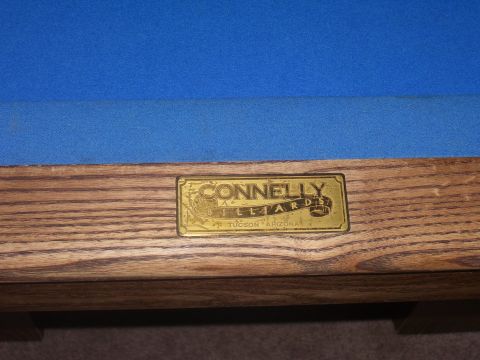 1991 Ford Bronco - A brass plaque on a wooden pool table reads "Connelly Billiards, Tucson Arizona".