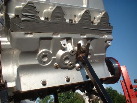 1969 Mercury Cyclone - A silver engine block is shown from the side, with black tape covering the top portion.