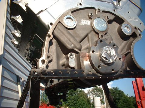 1969 Mercury Cyclone - Close-up view of an engine block's rear main seal area, mounted on a stand.