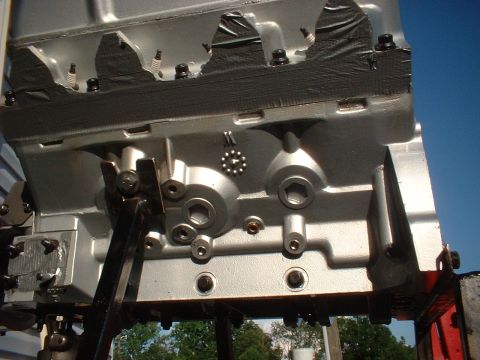 1969 Mercury Cyclone - Close-up view of an engine block, showing spark plug holes and various bolts.