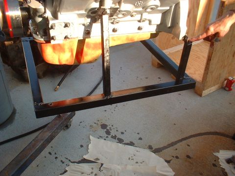 1969 Mercury Cyclone - An engine is mounted on a custom metal stand, ready for maintenance or repair.