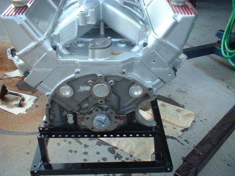 1969 Mercury Cyclone - A silver V8 engine, likely a performance build, is mounted on a stand. Edelbrock branding is visible on the valve covers.